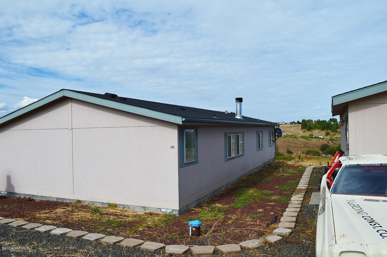 205 Mini Pines Road Yakima, WA 98903 - Photo 21 of 23 a house view with a backyard space