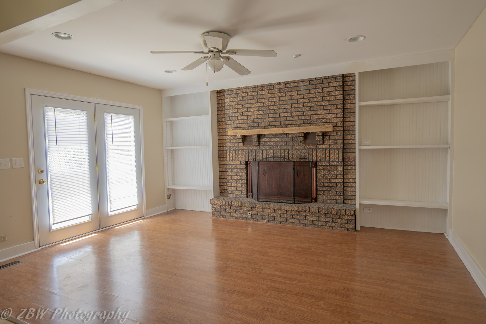 129 South Orchard Drive, Unit 1 Bolingbrook, IL 60440 - Photo 5 of 14 a view of an empty room with a fireplace and a window