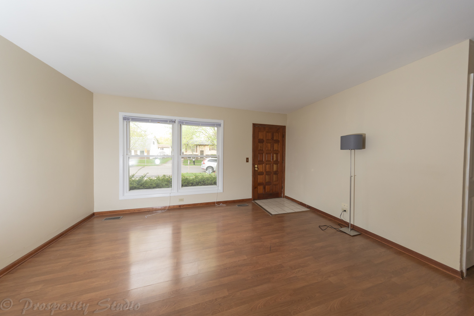 129 South Orchard Drive, Unit 1 Bolingbrook, IL 60440 - Photo 7 of 14 a view of an empty room with a window