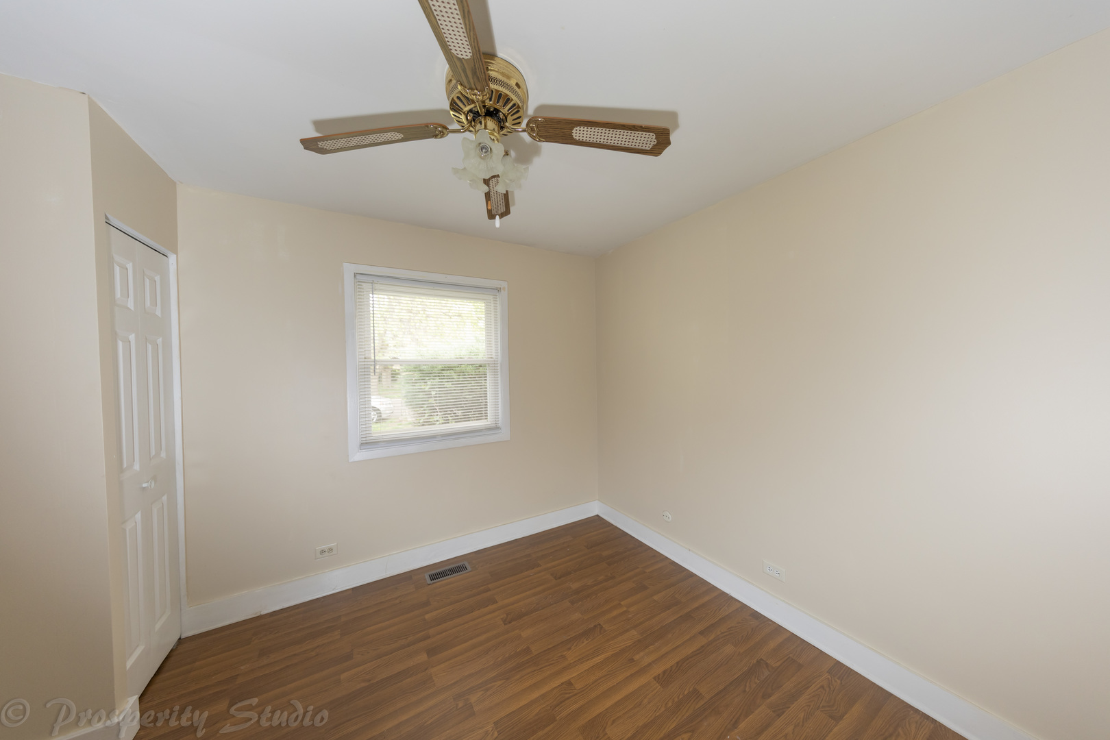 129 South Orchard Drive, Unit 1 Bolingbrook, IL 60440 - Photo 9 of 14 a view of empty room with wooden floor and fan