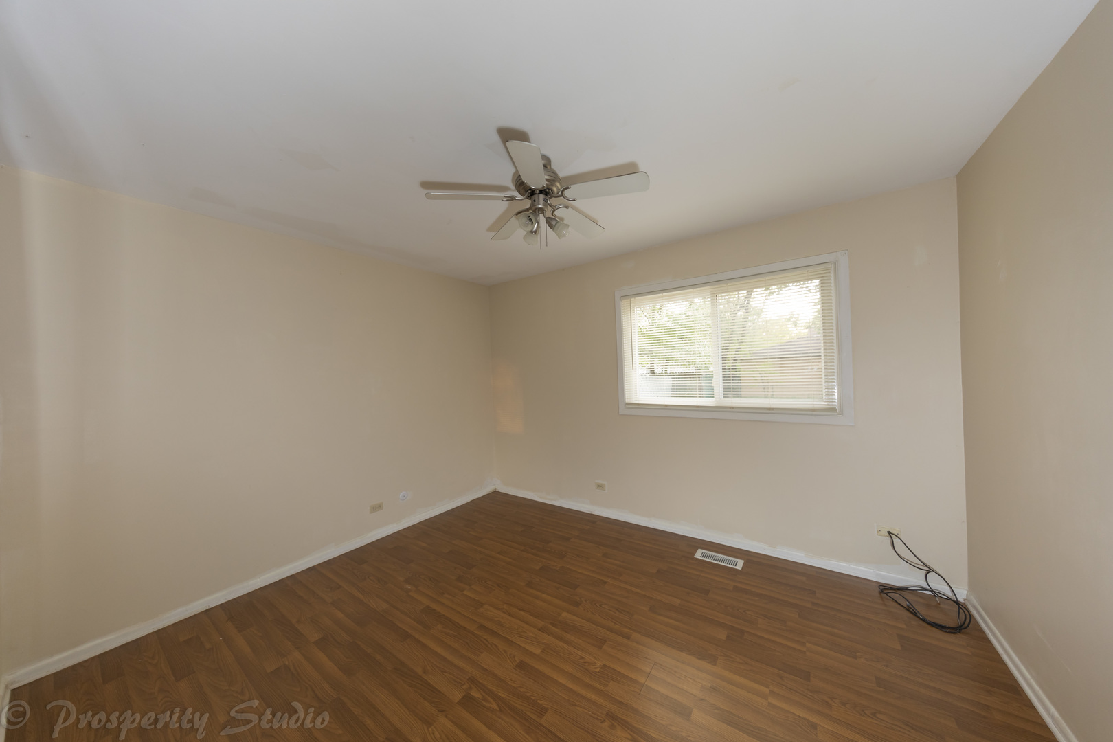 129 South Orchard Drive, Unit 1 Bolingbrook, IL 60440 - Photo 10 of 14 a view of a room with wooden floor and a ceiling fan
