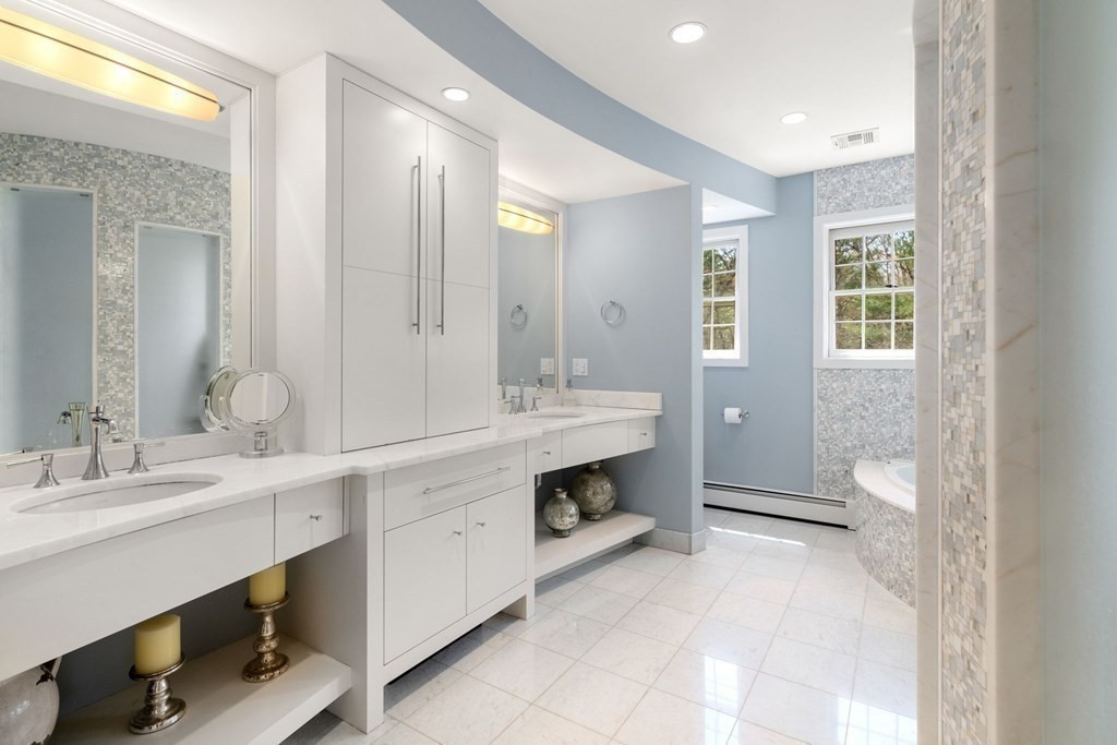 47 Claypit Hill Road Wayland, MA 01778 - Photo 13 of 21 a spacious bathroom with a double vanity sink a toilet and a mirror