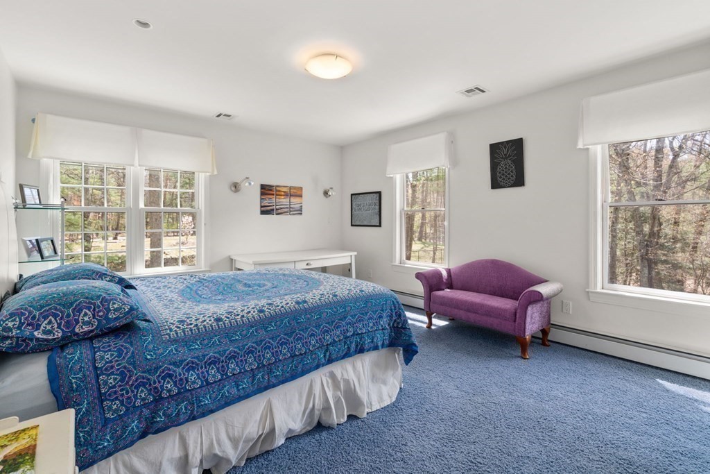 47 Claypit Hill Road Wayland, MA 01778 - Photo 14 of 21 a bedroom with a bed chair and a large window