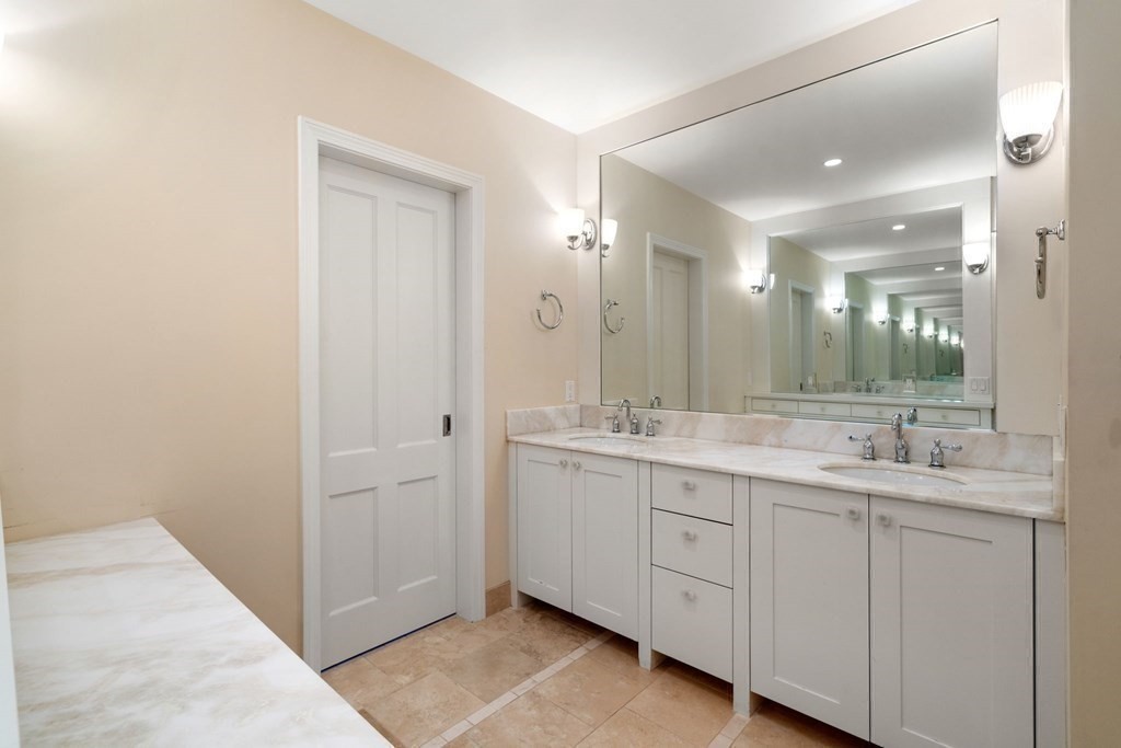 47 Claypit Hill Road Wayland, MA 01778 - Photo 15 of 21 a bathroom with a double vanity sink and mirror