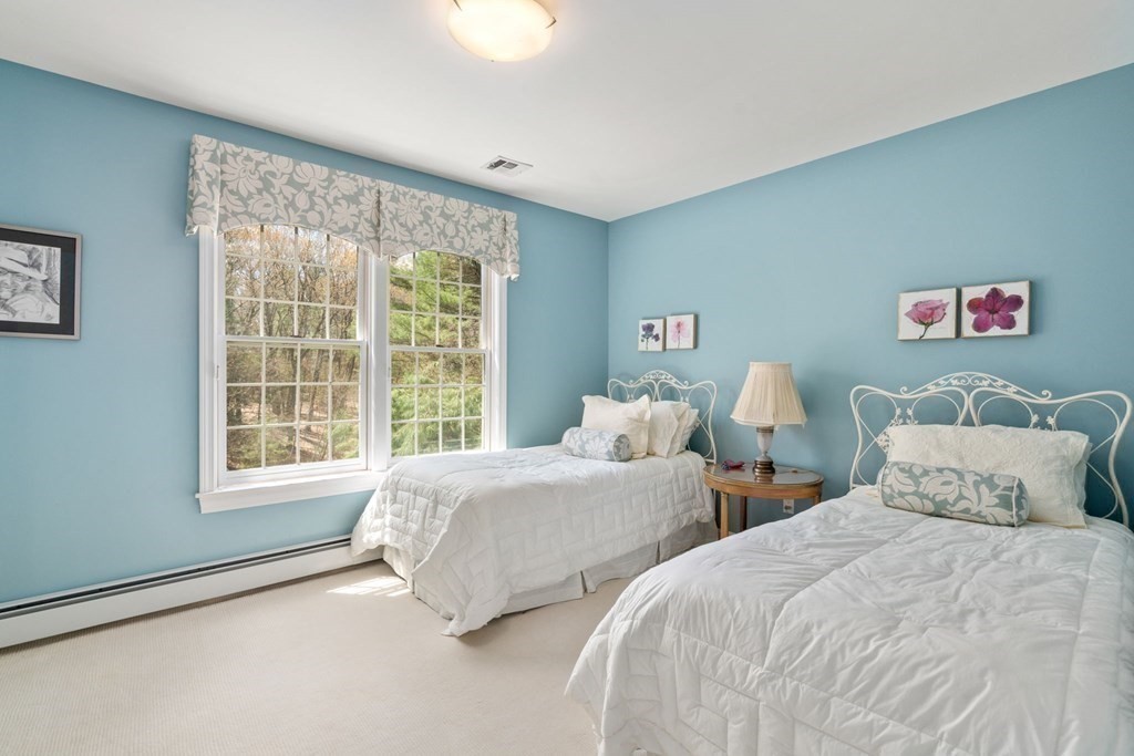 47 Claypit Hill Road Wayland, MA 01778 - Photo 16 of 21 a bedroom with two beds and a large window