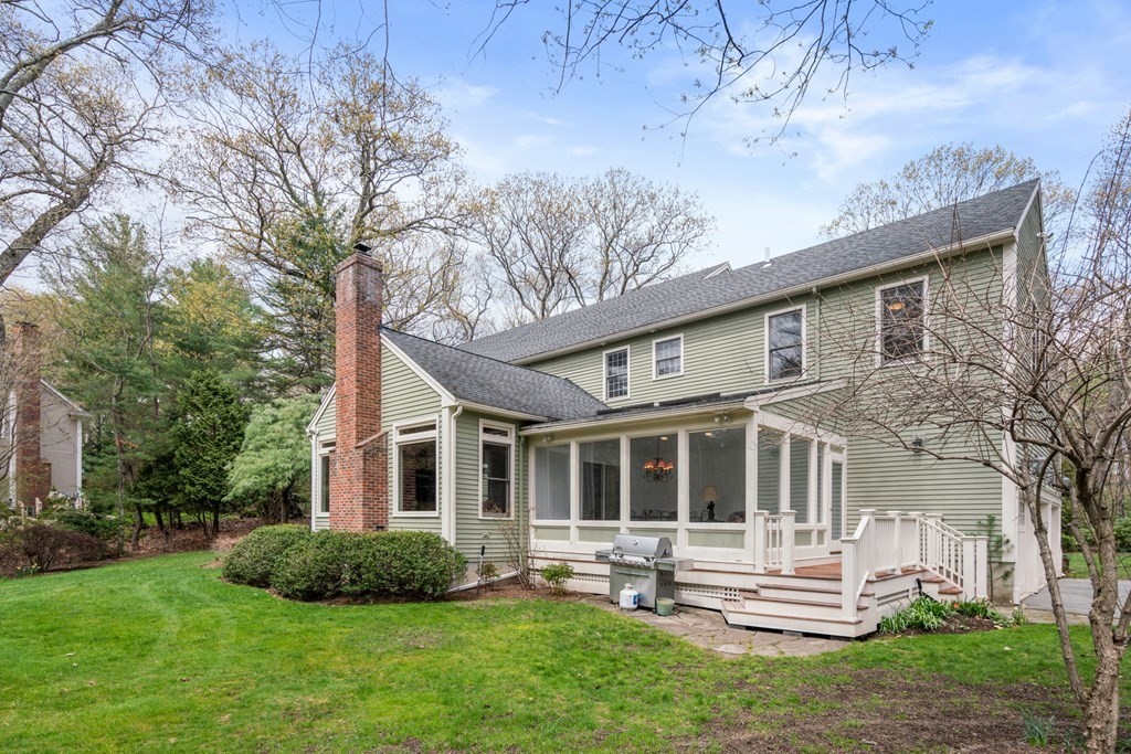 47 Claypit Hill Road Wayland, MA 01778 - Photo 18 of 21 a front view of a house with a yard and green space