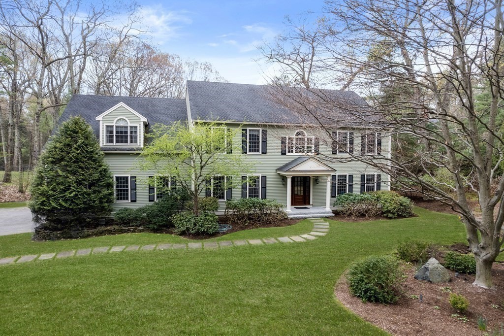 47 Claypit Hill Road Wayland, MA 01778 - Photo 2 of 21 a front view of house with yard and green space