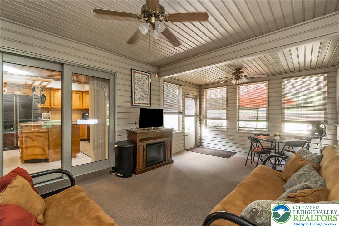 2298 Yost Road Bath, PA 18014 - Photo 30 of 33 Sun-filled enclosed patio provides a relaxing retreat with ample space for leisure and dining.