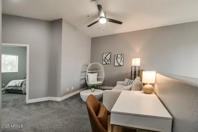 a bedroom with furniture and a window