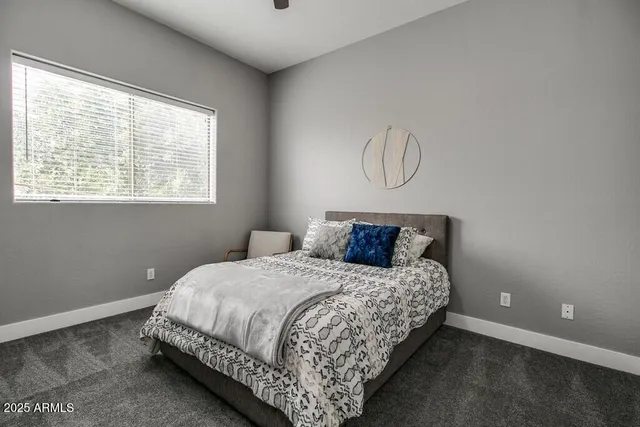 a bedroom with a bed and window