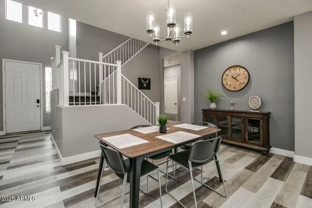a view of a room with furniture and kitchen view