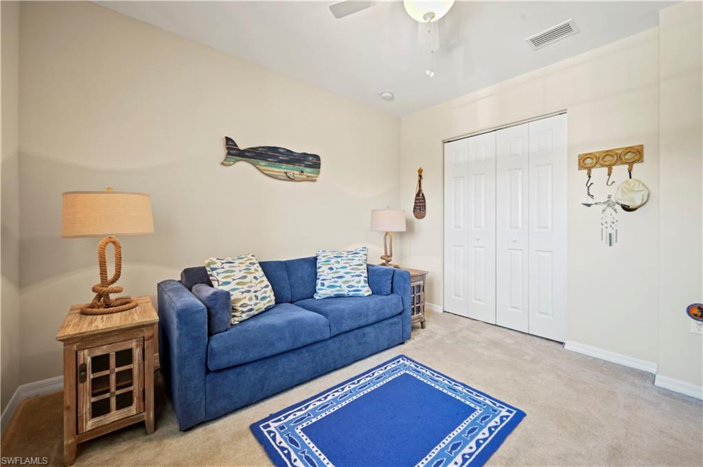 3922 Cherrybrook Loop Fort Myers, FL 33966 - Photo 14 of 38 a living room with furniture a rug and a window