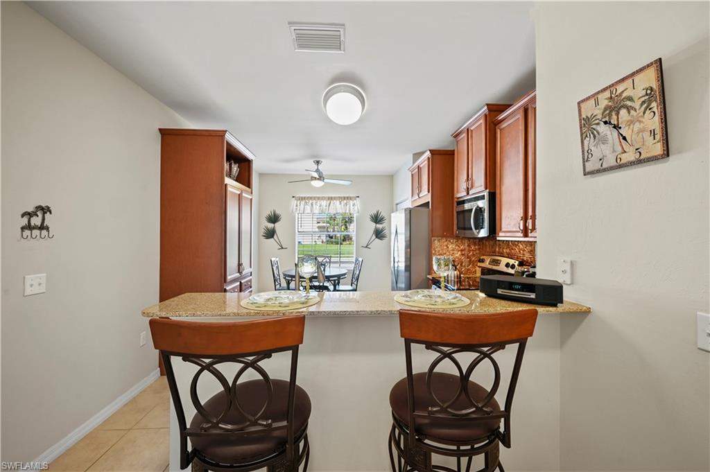 3922 Cherrybrook Loop Fort Myers, FL 33966 - Photo 18 of 38 a dining room with furniture and window