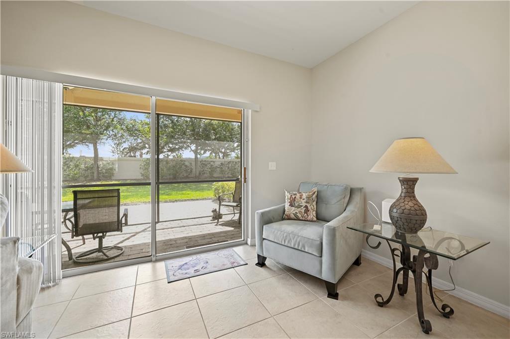 3922 Cherrybrook Loop Fort Myers, FL 33966 - Photo 20 of 38 a living room with furniture and a floor to ceiling window
