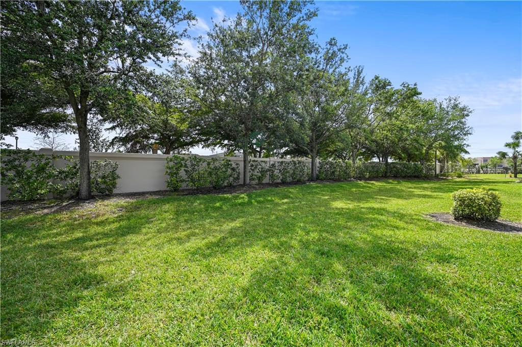3922 Cherrybrook Loop Fort Myers, FL 33966 - Photo 27 of 38 a view of a backyard with a garden