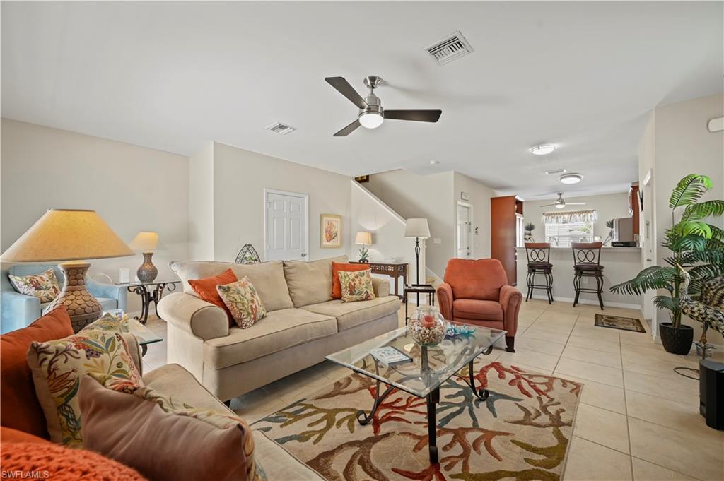 3922 Cherrybrook Loop Fort Myers, FL 33966 - Photo 3 of 38 a living room with furniture and a chandelier