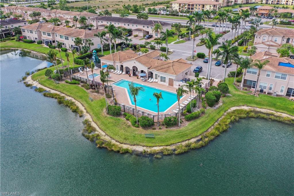 3922 Cherrybrook Loop Fort Myers, FL 33966 - Photo 36 of 38 a view of a swimming pool with a garden