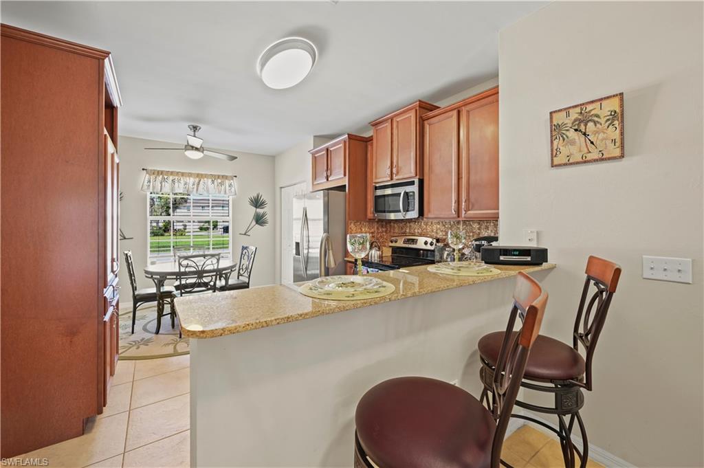 3922 Cherrybrook Loop Fort Myers, FL 33966 - Photo 5 of 38 a dining room with furniture and window