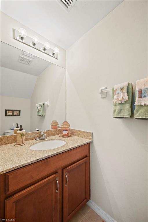 3922 Cherrybrook Loop Fort Myers, FL 33966 - Photo 8 of 38 a bathroom with a granite countertop sink and a mirror