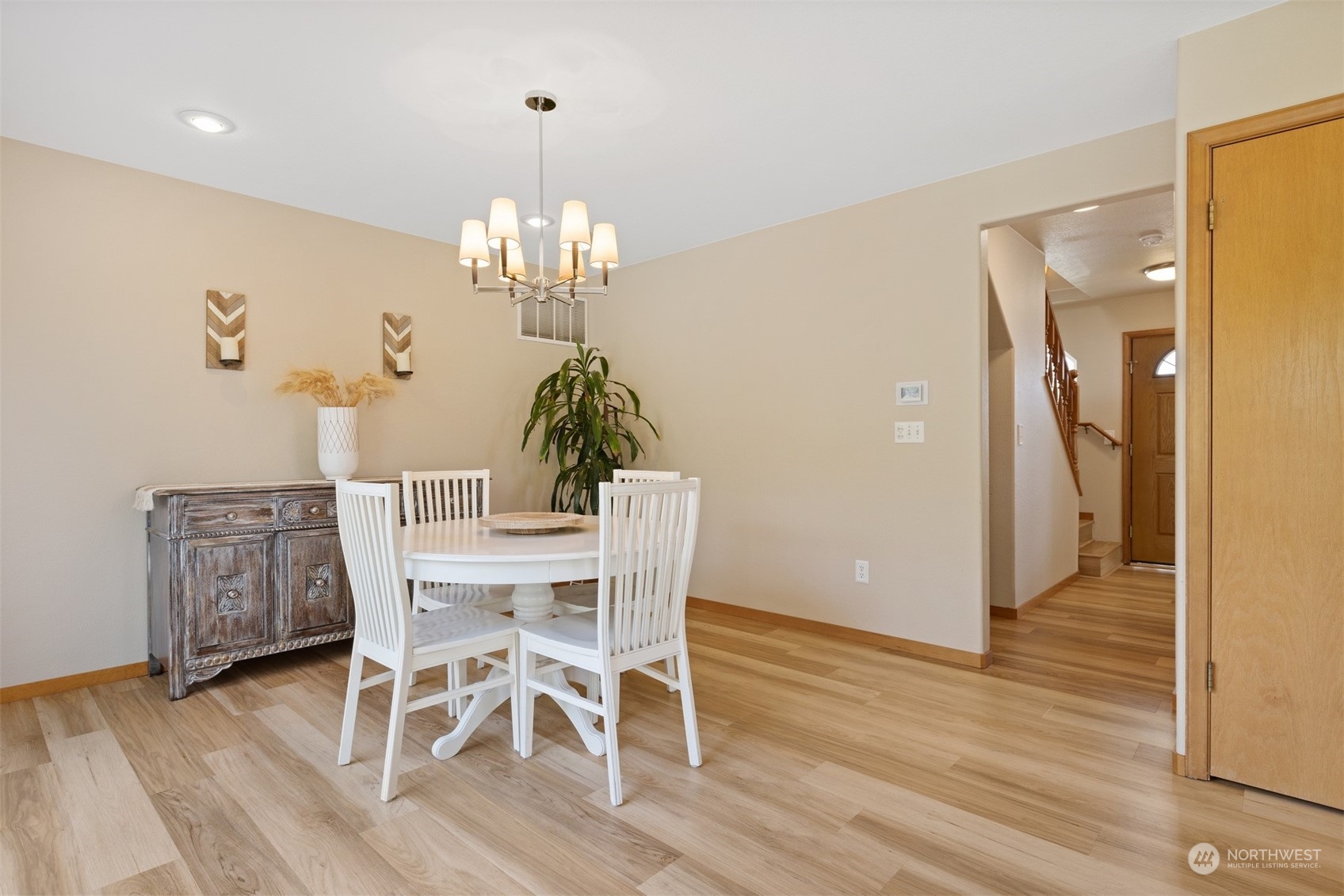 1308 Roma Road Bellingham, WA 98226 - Photo 12 of 39 a view of a dining room with furniture a chandelier and wooden floor