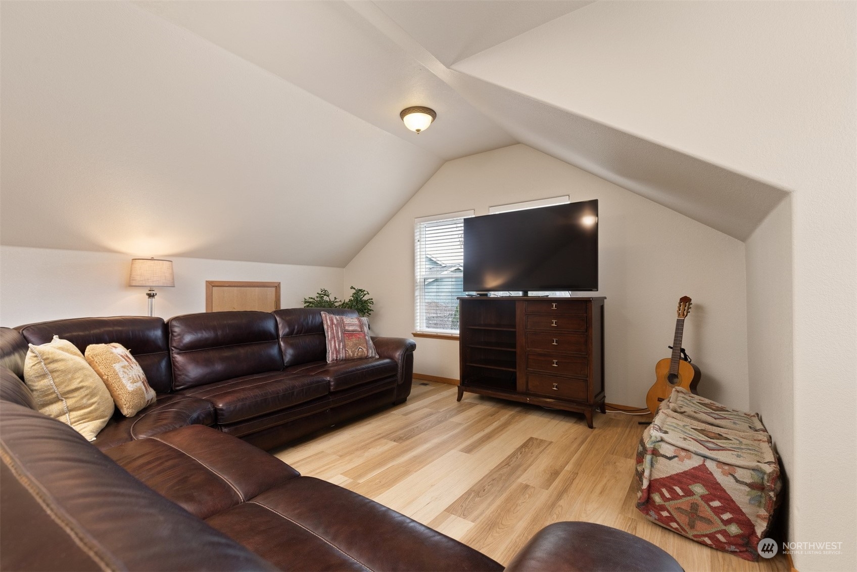 1308 Roma Road Bellingham, WA 98226 - Photo 30 of 39 a living room with furniture and a flat screen tv