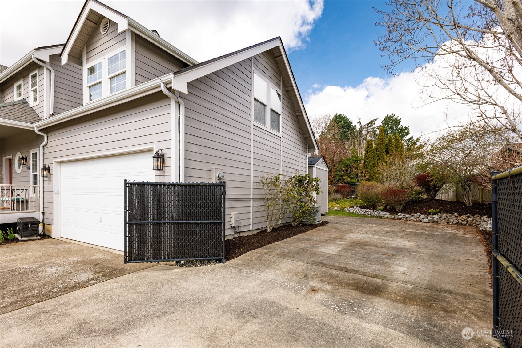 1308 Roma Road Bellingham, WA 98226 - Photo 32 of 39 a view of a house with a snow in the yard