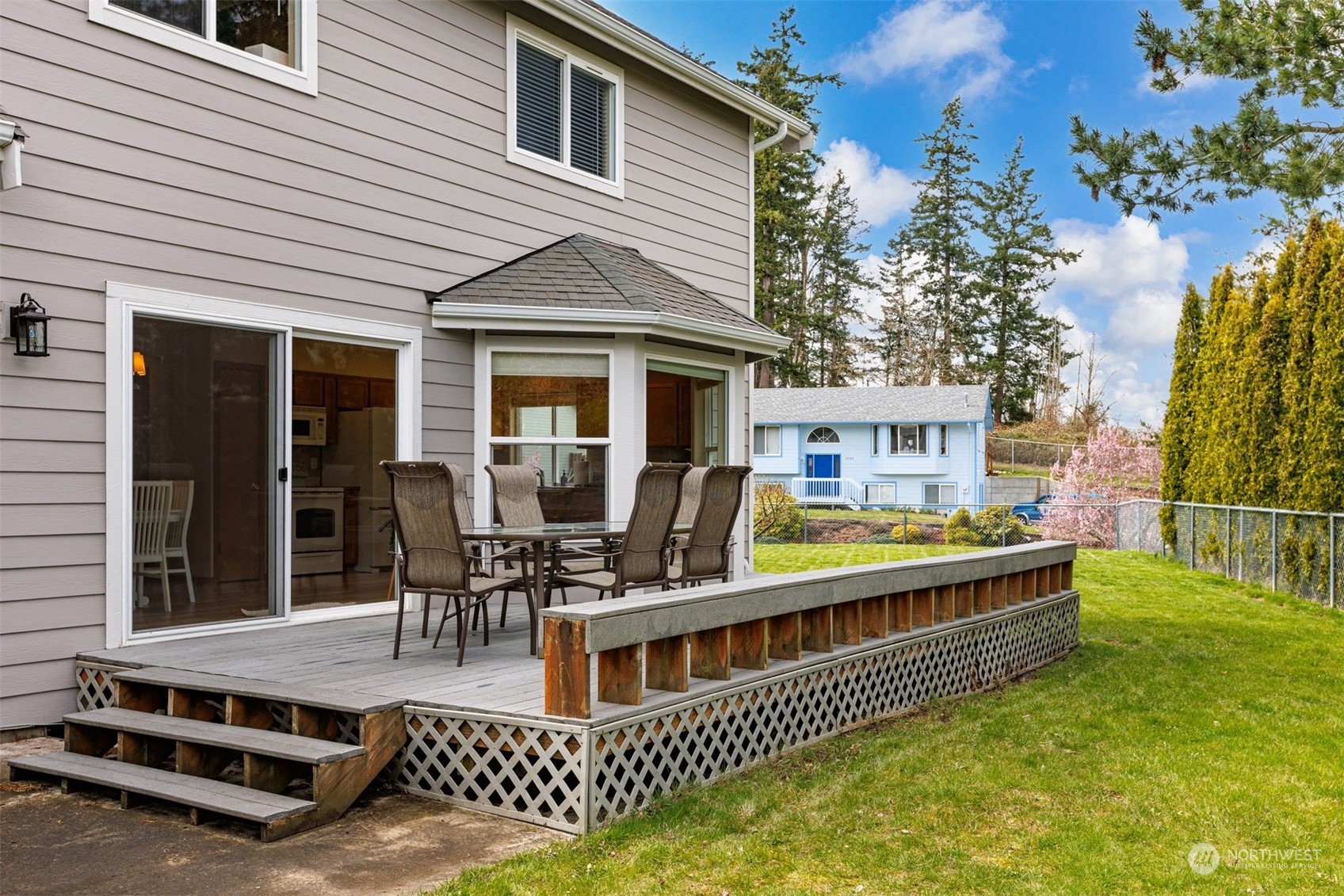 1308 Roma Road Bellingham, WA 98226 - Photo 34 of 39 a view of a house with wooden deck and furniture
