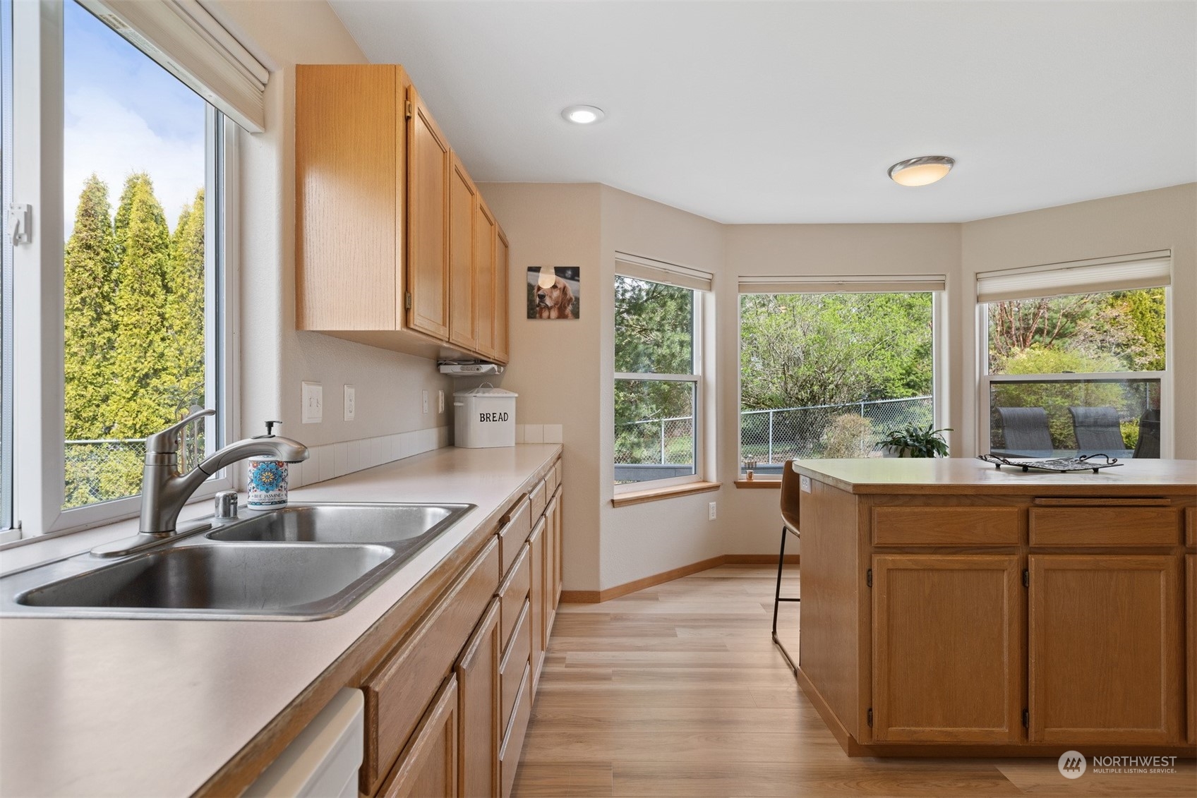 1308 Roma Road Bellingham, WA 98226 - Photo 9 of 39 a kitchen with a sink a counter top space and stainless steel appliances