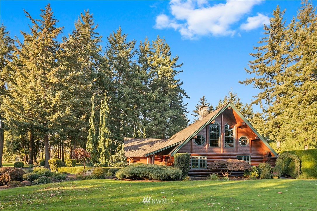 698 West Pole Road Ferndale, WA 98248 - Photo 2 of 40 a front view of a house with a yard