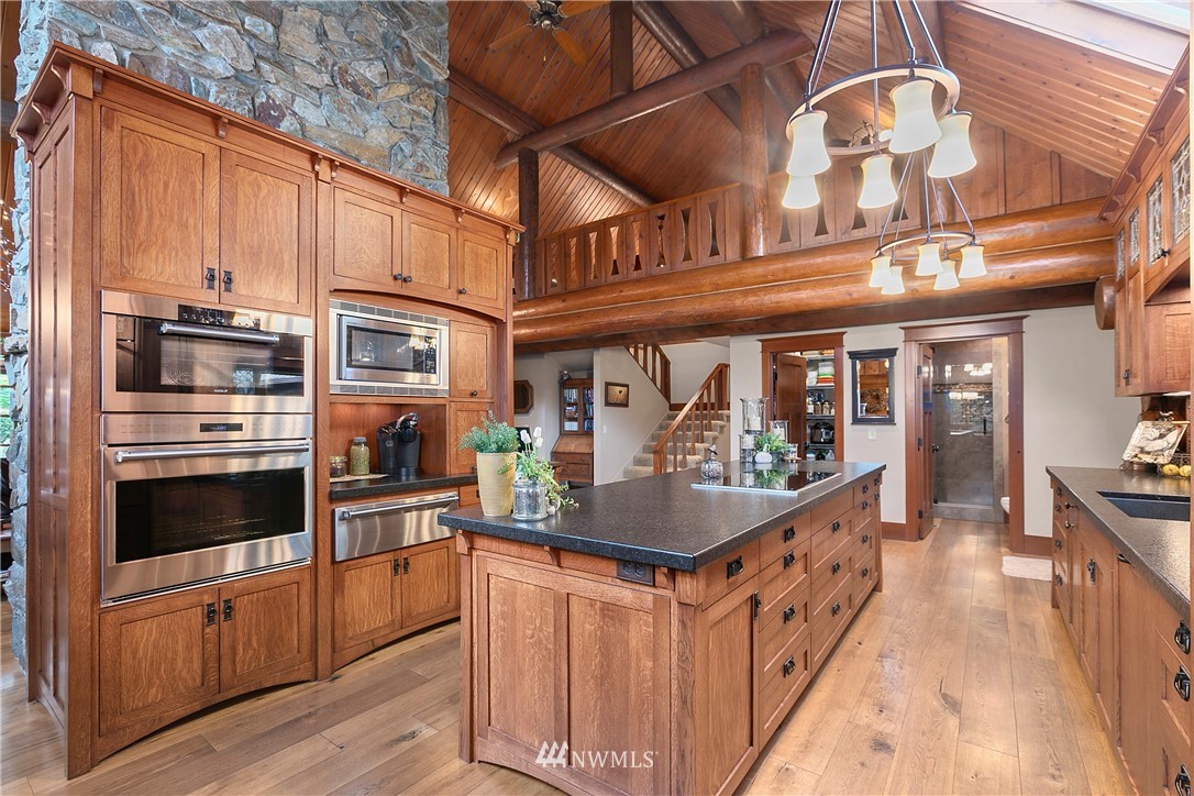 698 West Pole Road Ferndale, WA 98248 - Photo 23 of 40 a kitchen with stainless steel appliances granite countertop a sink and cabinets