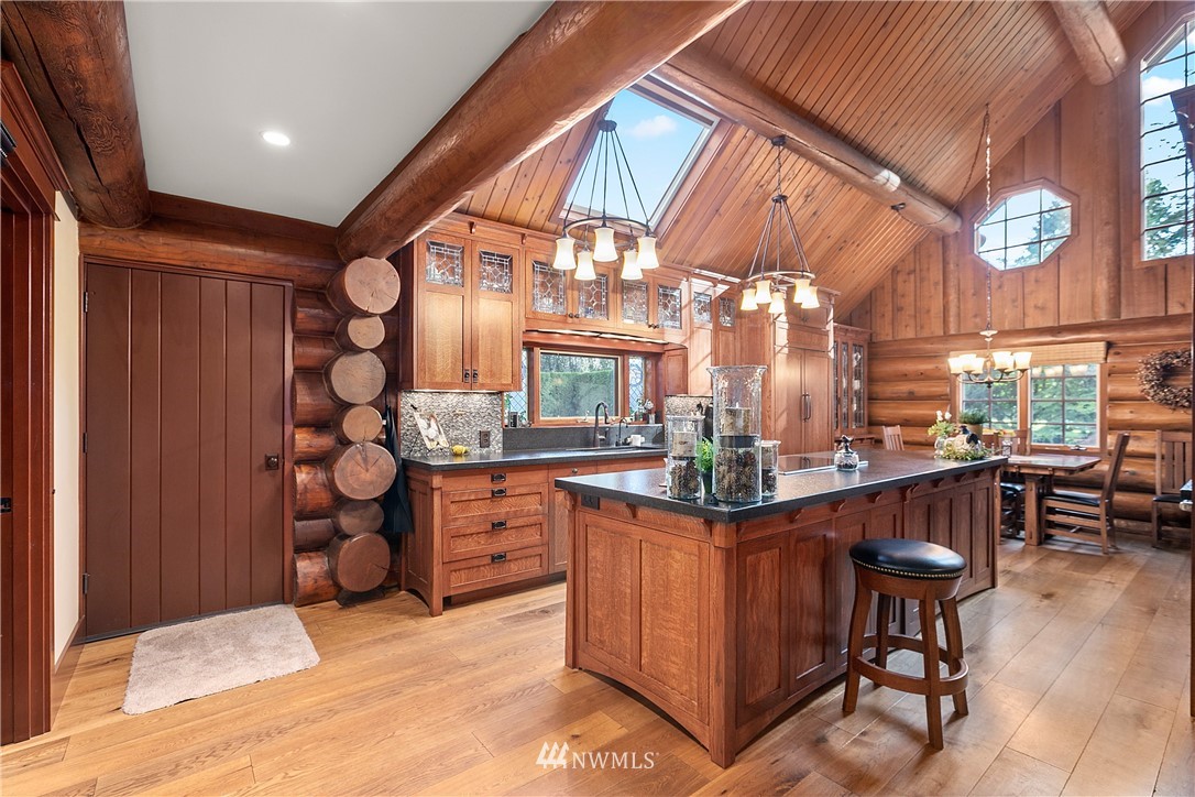698 West Pole Road Ferndale, WA 98248 - Photo 24 of 40 a kitchen with stainless steel appliances granite countertop a sink and cabinets