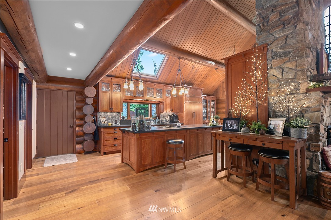 698 West Pole Road Ferndale, WA 98248 - Photo 27 of 40 a room with stainless steel appliances kitchen island granite countertop furniture and a fireplace