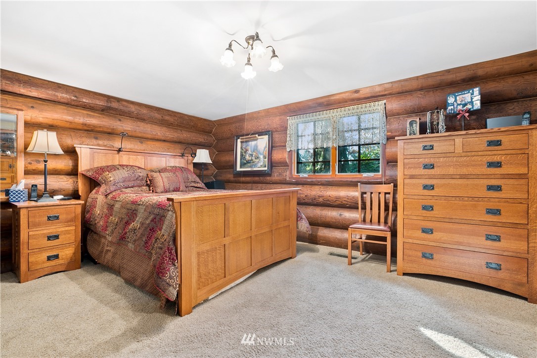 698 West Pole Road Ferndale, WA 98248 - Photo 29 of 40 a bed room with a bed and a dresser
