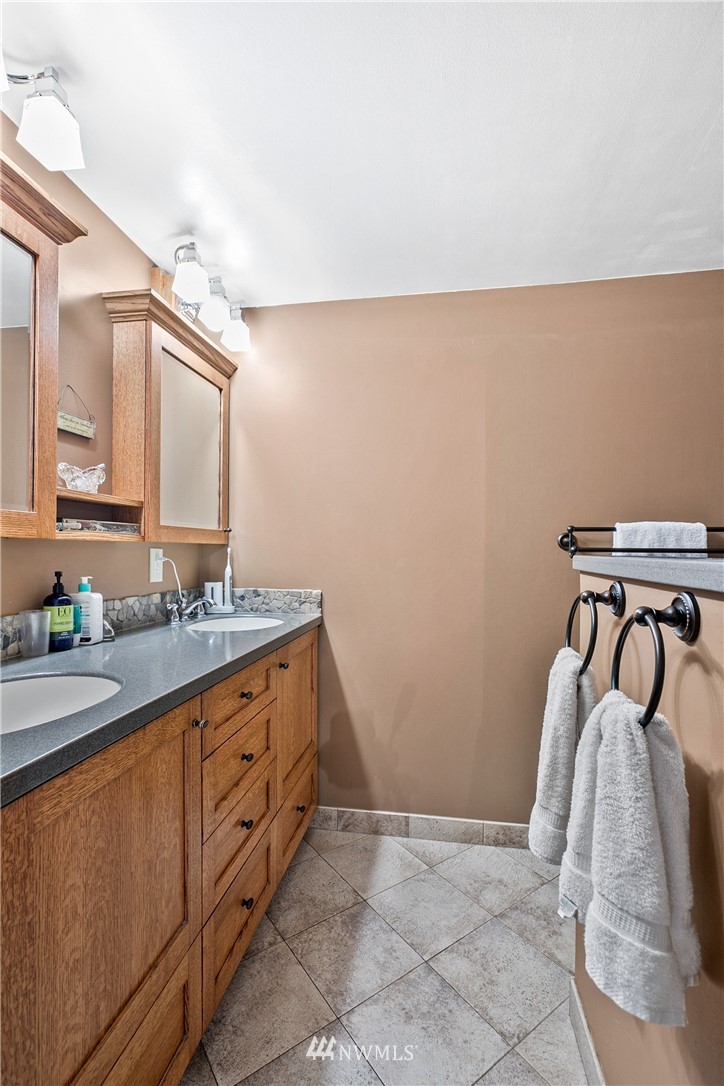 698 West Pole Road Ferndale, WA 98248 - Photo 30 of 40 a bathroom with a sink and mirror