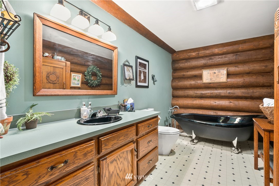 698 West Pole Road Ferndale, WA 98248 - Photo 34 of 40 a bathroom with a sink a toilet and a mirror