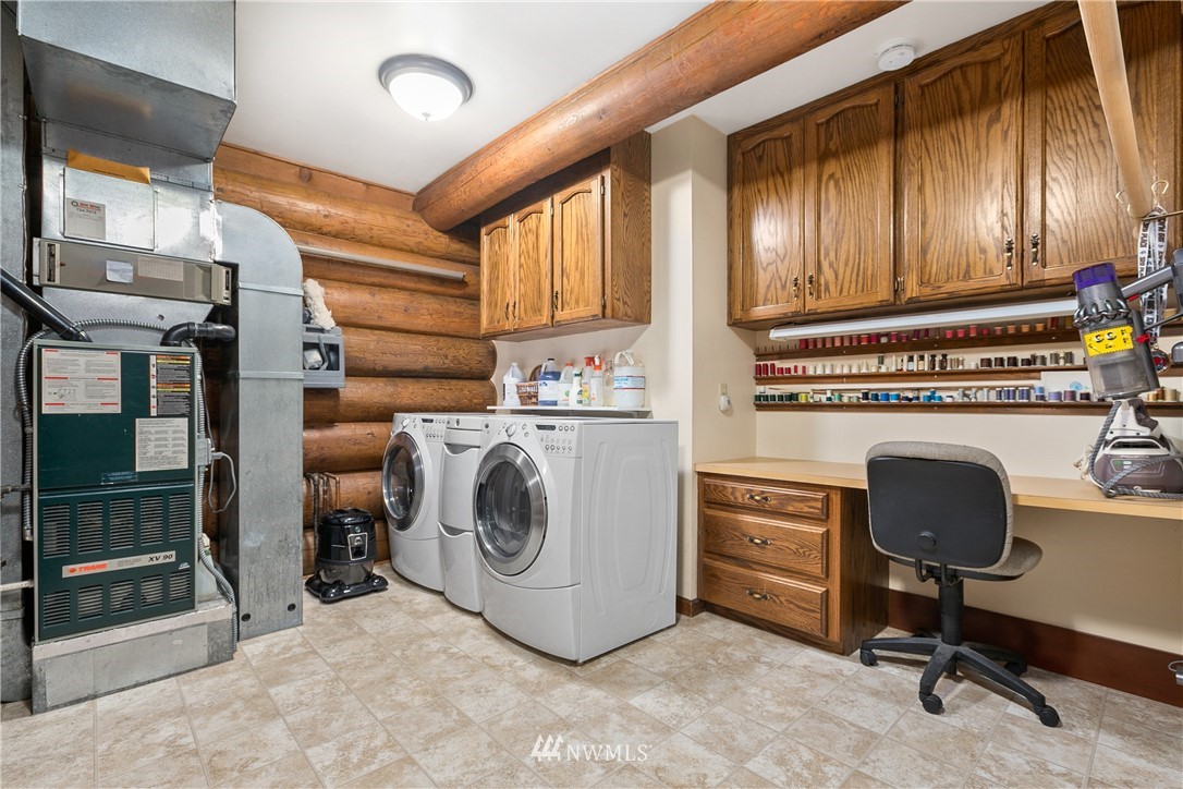 698 West Pole Road Ferndale, WA 98248 - Photo 35 of 40 a view of a storage & utility room with washer and dryer