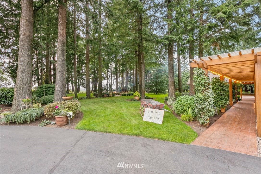 698 West Pole Road Ferndale, WA 98248 - Photo 8 of 40 a backyard of a house with fountain and outdoor seating