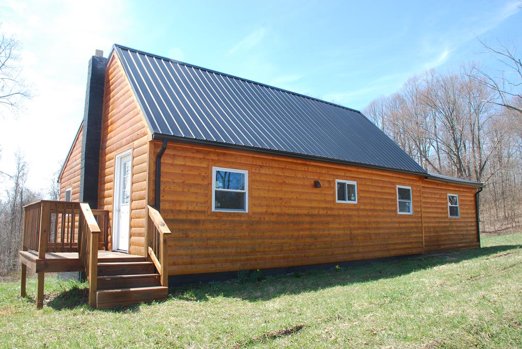 771 Deckards Run Road Utica, PA 16362 - Photo 1 of 1 a front view of a house with a yard