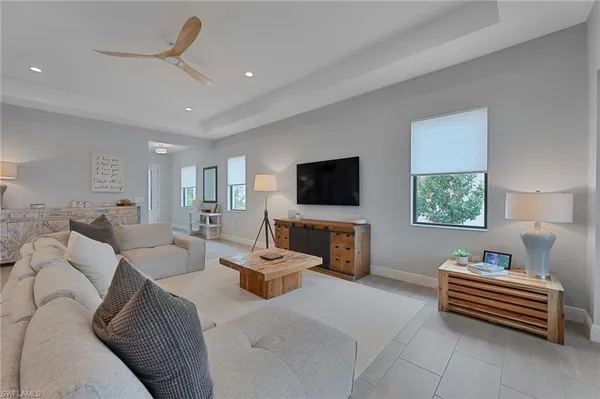 a large white kitchen with a large window