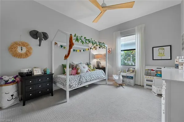 a bedroom with furniture and a window