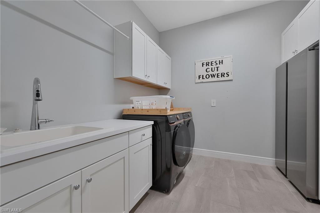 4007 Pegasus Way Naples, FL 34120 - Photo 22 of 27 Laundry Room with Storage Built In