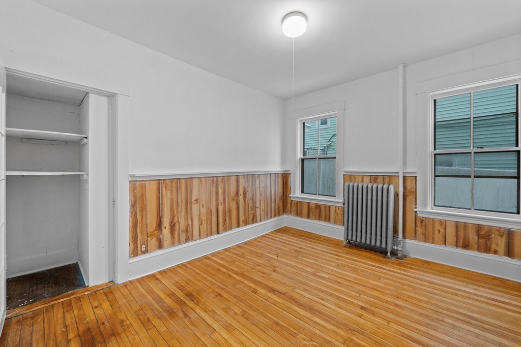 20 Temple Street, Unit 1 Fitchburg, MA 01420 - Photo 11 of 25 a view of a room with wooden floor and a window
