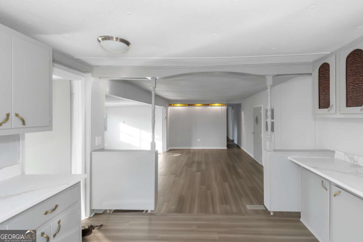 24 David Drive Hampton, GA 30228 - Photo 13 of 21 a view of empty room with wooden floor