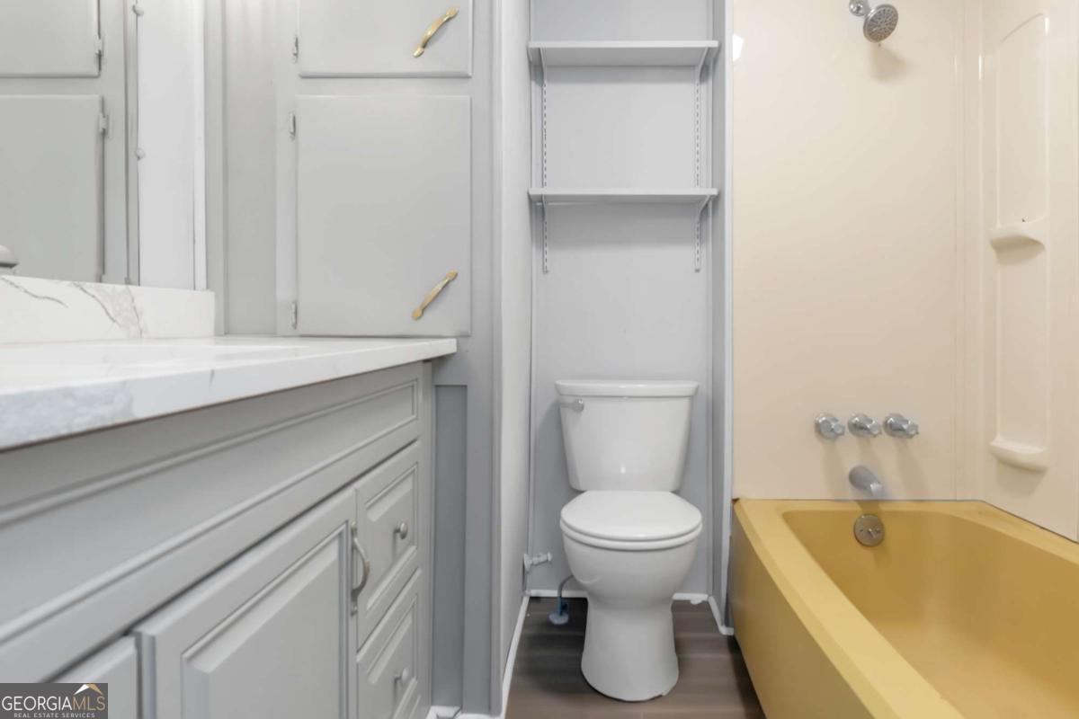 24 David Drive Hampton, GA 30228 - Photo 19 of 21 a bathroom with a sink and a bathtub