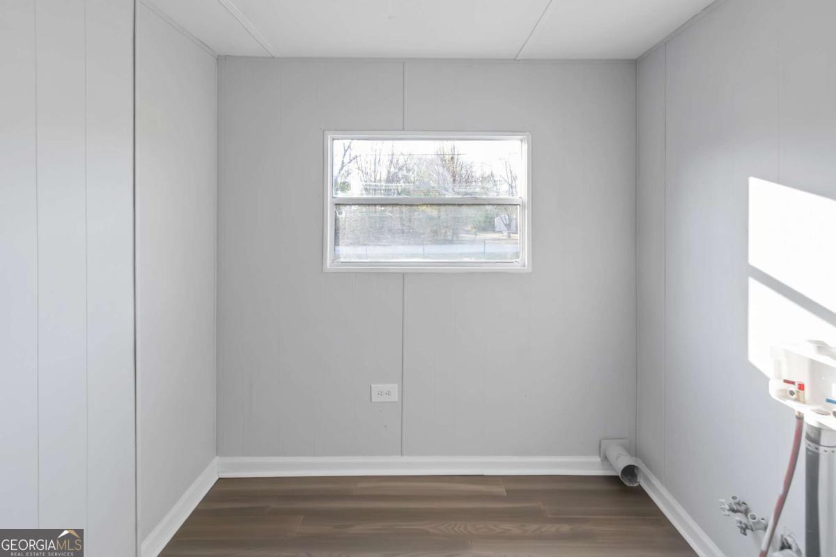 24 David Drive Hampton, GA 30228 - Photo 20 of 21 an empty room with an empty room and window