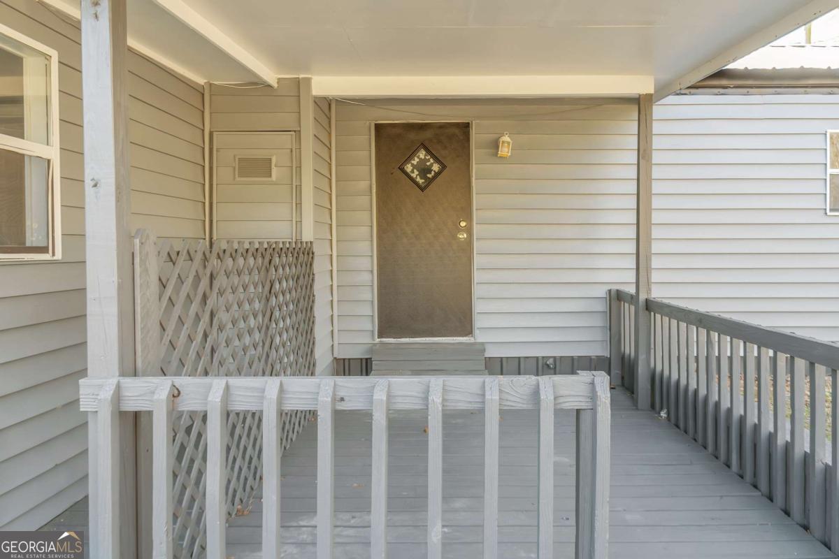 24 David Drive Hampton, GA 30228 - Photo 4 of 21 a view of a porch