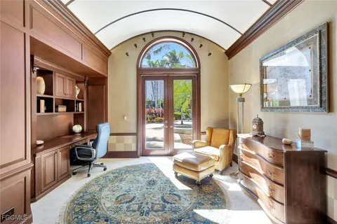 a spacious bathroom with a tub sink and mirror