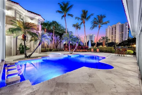 a view of swimming pool with outdoor seating