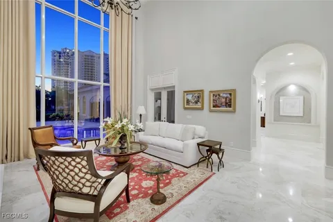 a view of a hallway with entryway wooden floor and front door