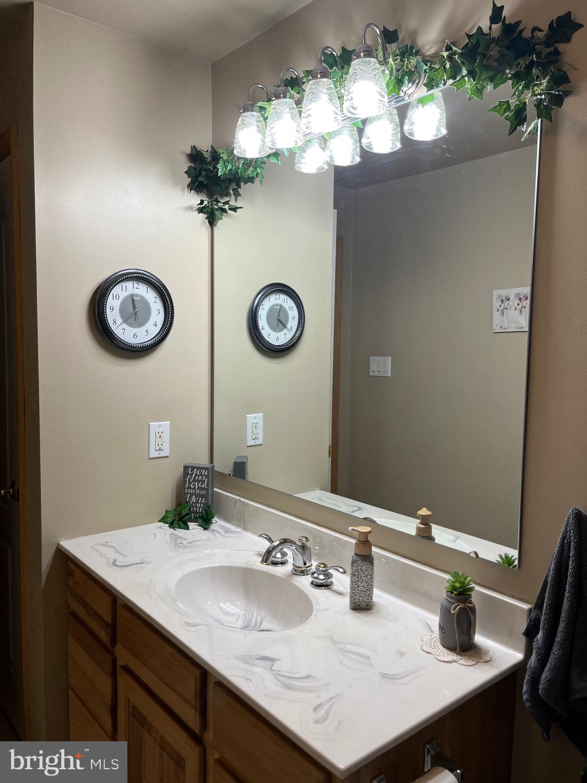 3843 Dressler Ridge Road Mount Pleasant Mills, PA 17853 - Photo 29 of 43 a bathroom with a sink vanity and a mirror